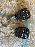 Two Clifford Alarm Key Fobs D: CZ57RRKO. Fixed Price $85.00.