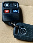 Genuine Ford & Mercury Keyless Entry Remote, F87B-15K601-AB, Oem. Fixed Price $55.00.